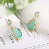 Elegant 18K gold-plated earrings with a stunning green oil drip drop design, perfect for any occasion.